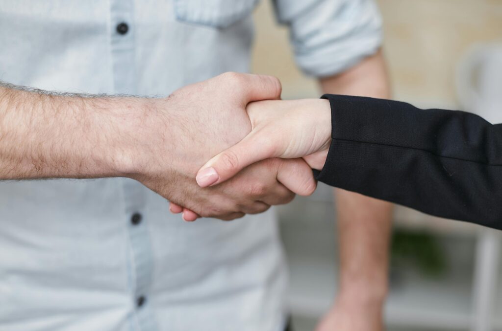Two people shaking hands.